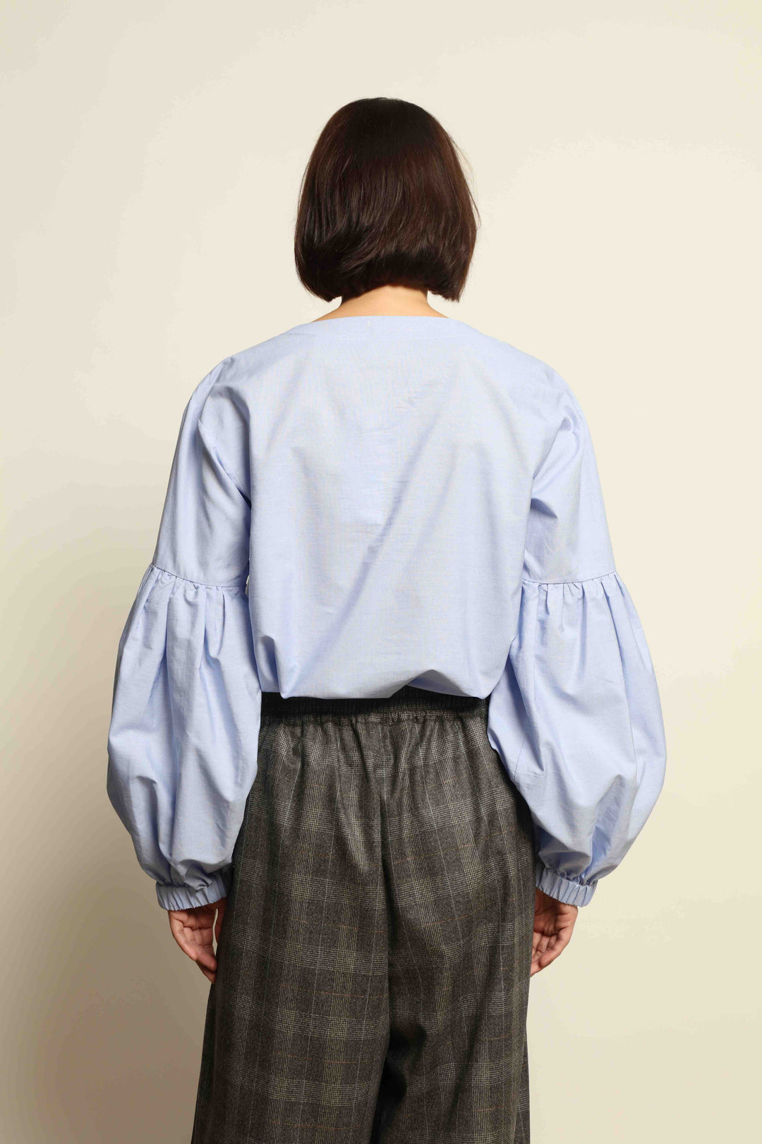 Model wearing the Sky Blue Lulu Pure Poplin Cotton Blouse with balloon sleeves by House of Nomad Stories, crafted in Italy.