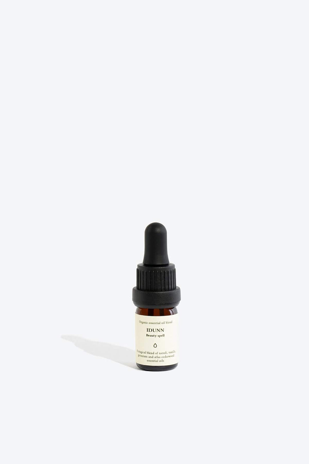 Essential organic oil blend Idunn by Smells Like Spells in amber glass bottle with dropper, natural skincare, Norse goddess of youth inspired fragrance, available at House of Nomad Stories.