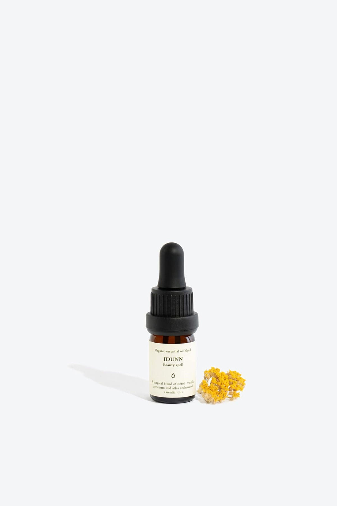 Essential organic oil blend Idunn by Smells Like Spells in amber glass bottle with dropper, natural skincare, Norse goddess of youth inspired fragrance, available at House of Nomad Stories.