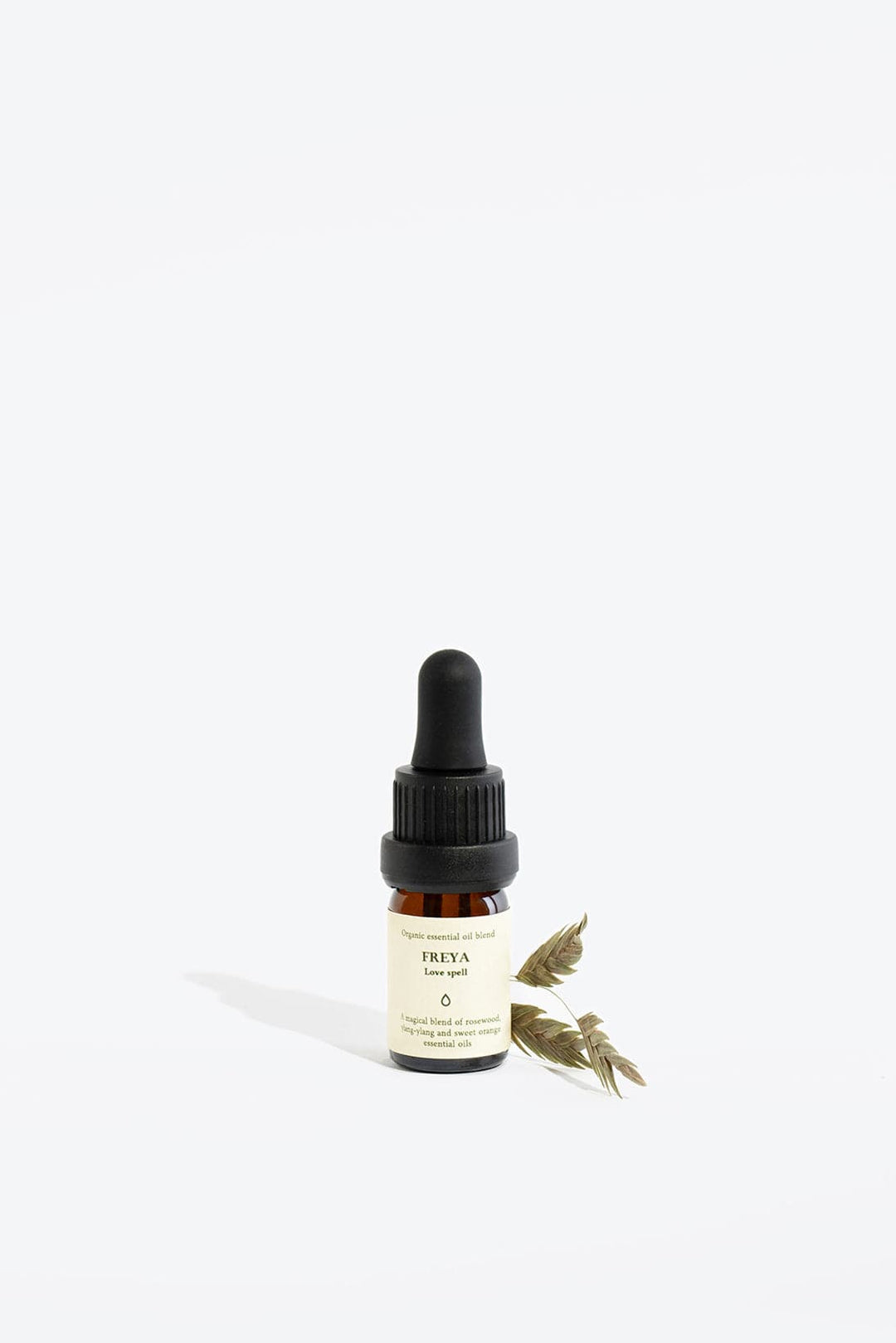 Essential Organic Oil Blend Freya by Smells Like Spells in glass bottle with wooden cap, natural handmade home fragrance for love and passion, available at House of Nomad Stories