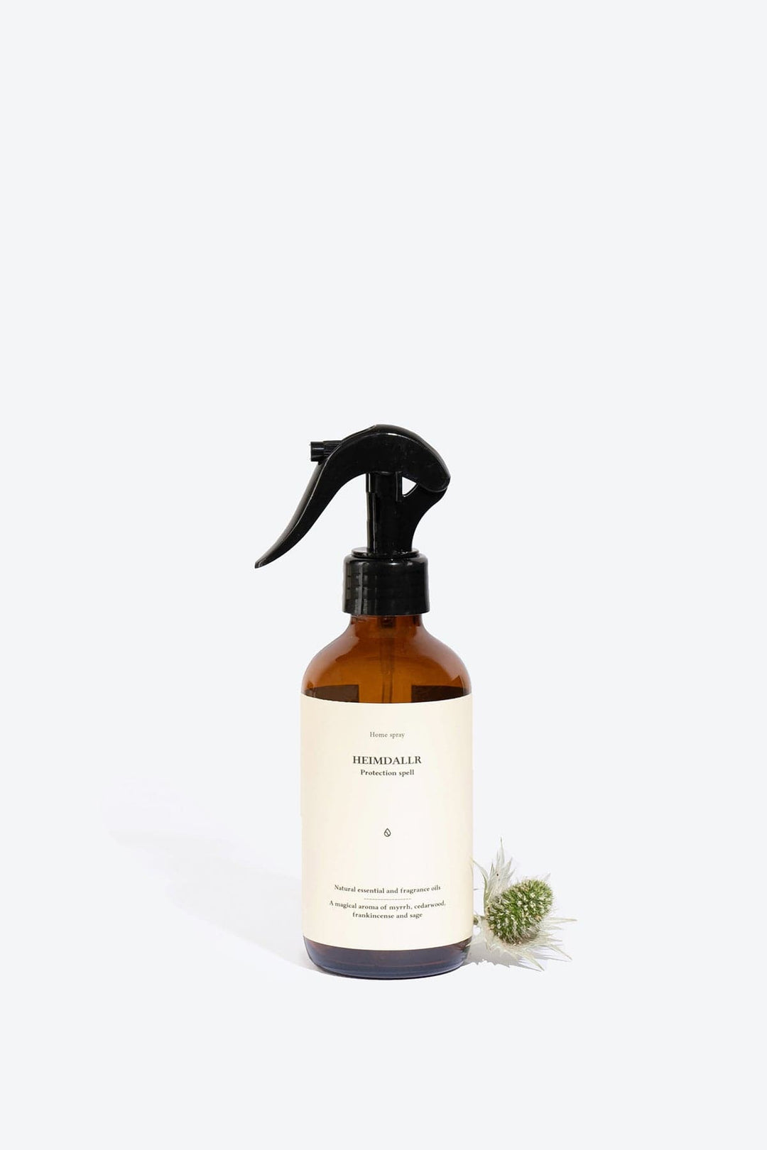Natural Heimdallr home perfume spray by Smells Like Spells. Elegant bottle with a subtle, earthy background, evoking protection and balance through rich notes of citrus, spices, and woods.