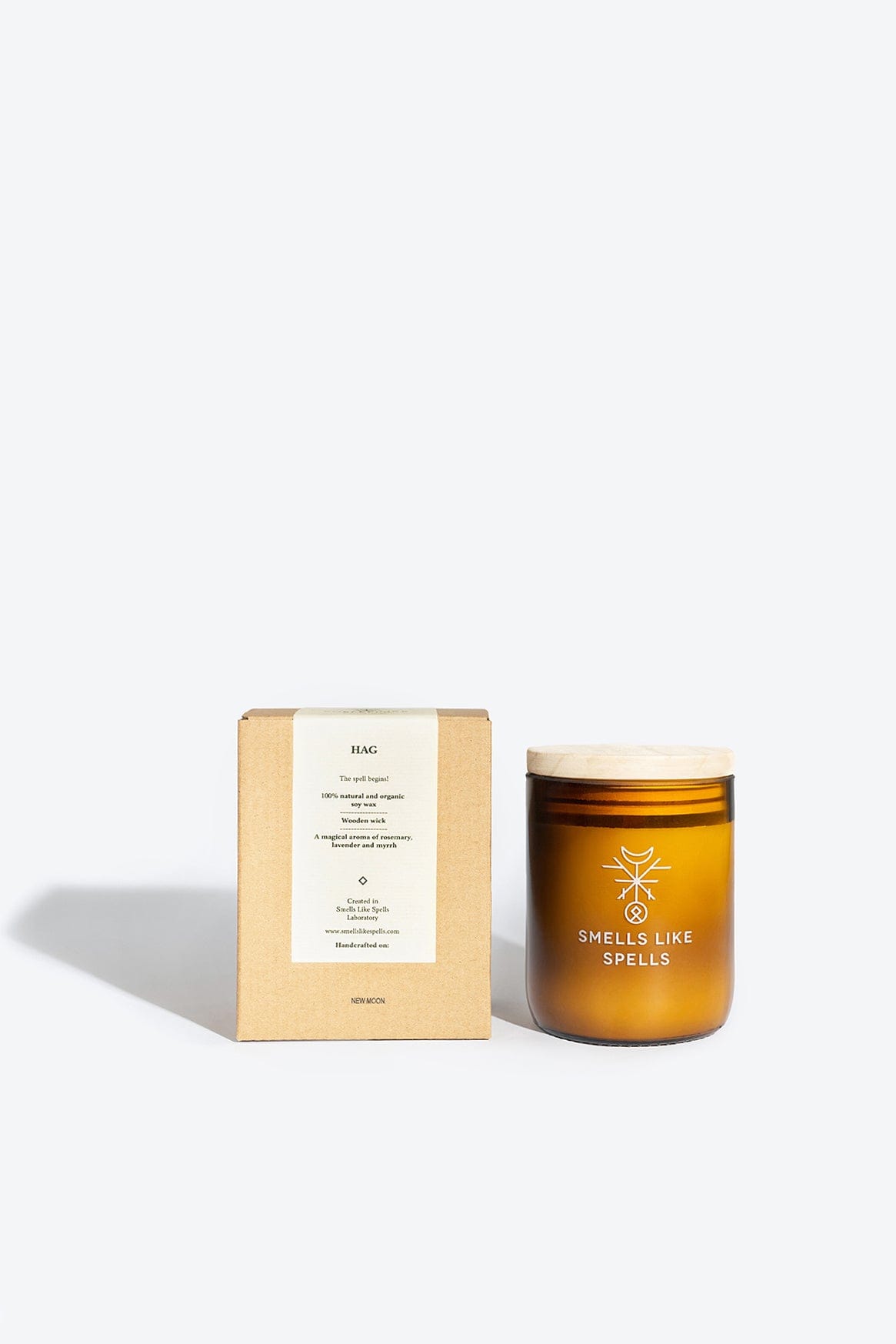 Handcrafted soy wax aromatic candle with rosemary, lavender, and myrrh scent by Smells Like Spells, designed to cleanse and purify home energy.