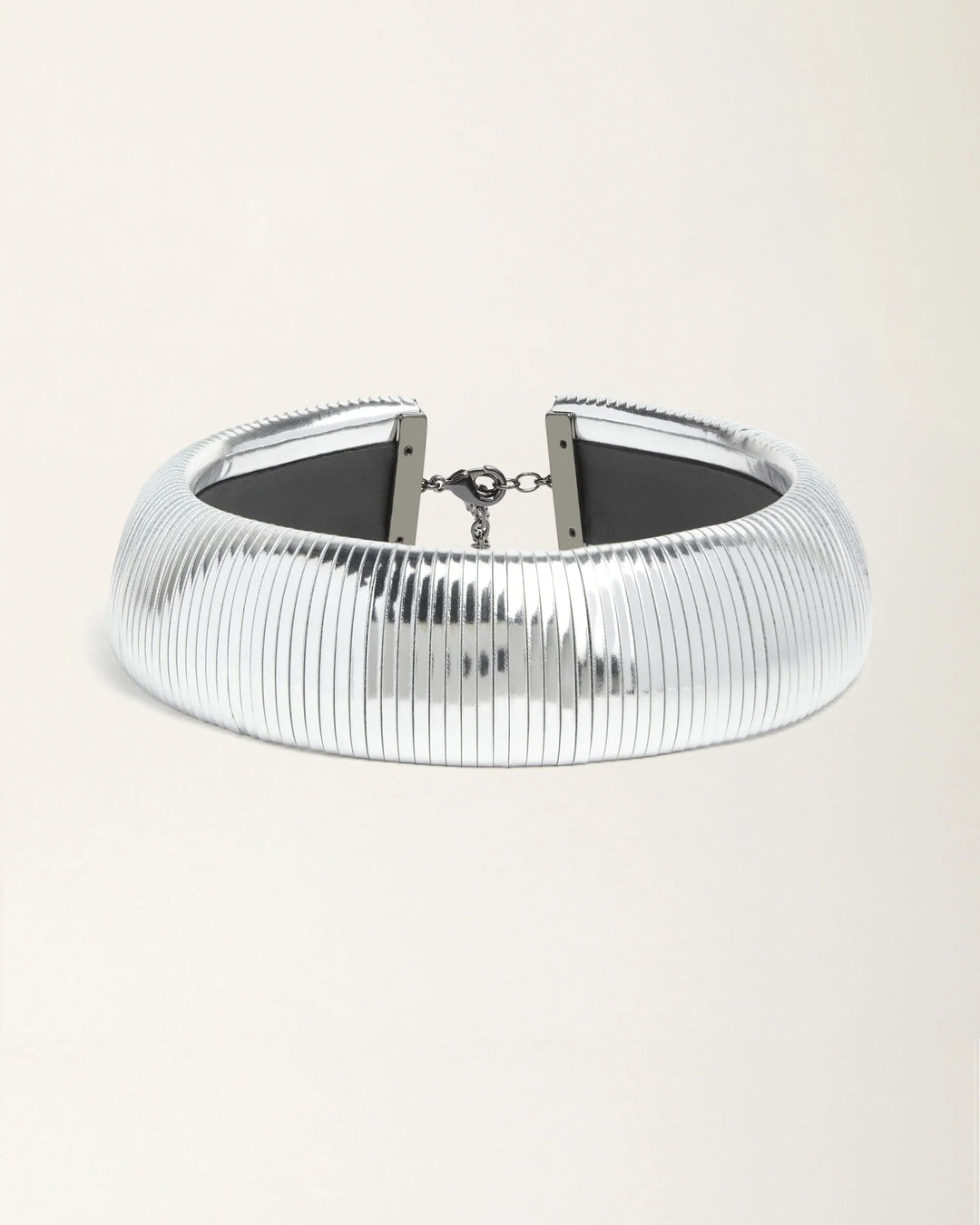 Halo Silver Foil leather necklace by SO-LE STUDIO, handcrafted in Tuscany, bold circular silver-toned design with foil finish, lightweight and sculptural on the neckline