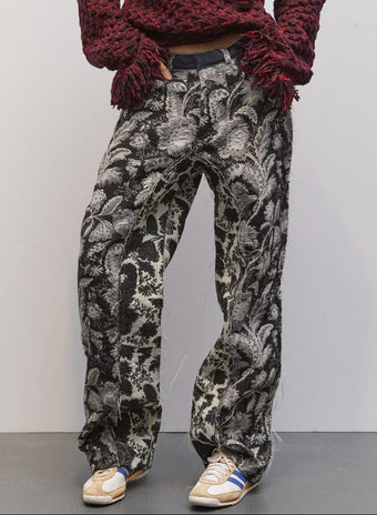 Model wearing the Tom Black Jacquard Pant by Maison Jejia, featuring textured black jacquard, sleek tailored silhouette, and relaxed contemporary fit